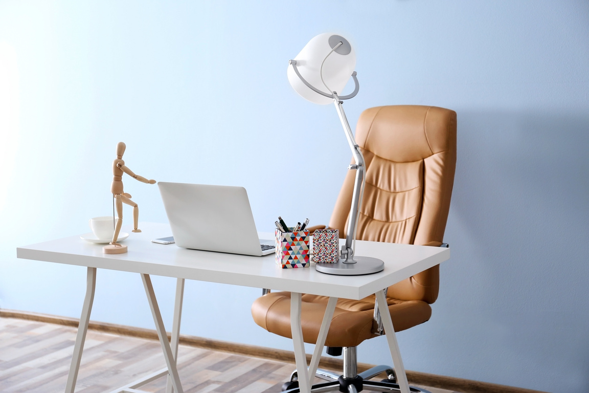 Modern Workplace with Office Chair and Laptop